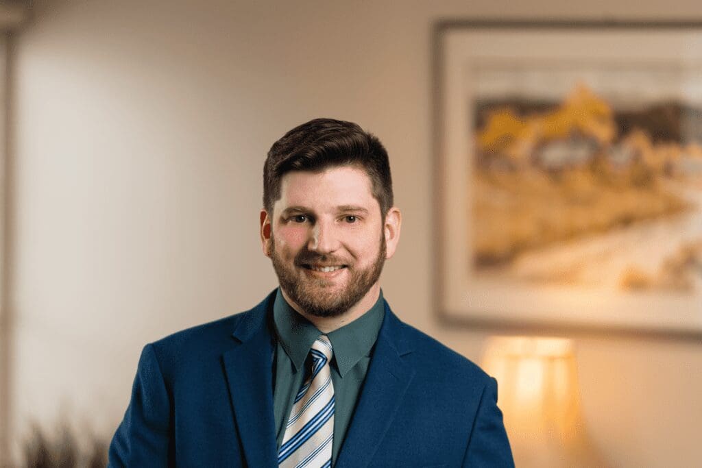 Professional headshot with blurred background